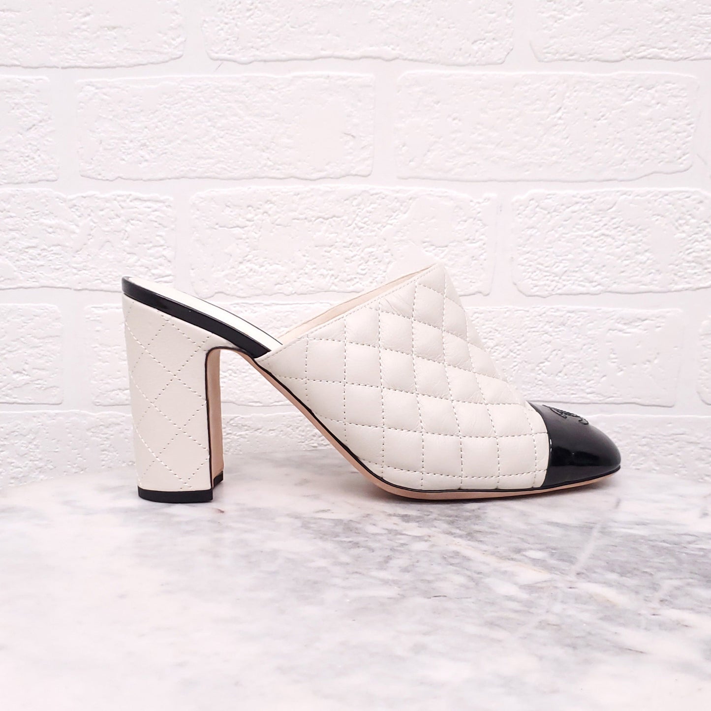 CHANEL CREAM AND BLACK TOE CAP QUILTED HEELED MULES - SIZE 41.5