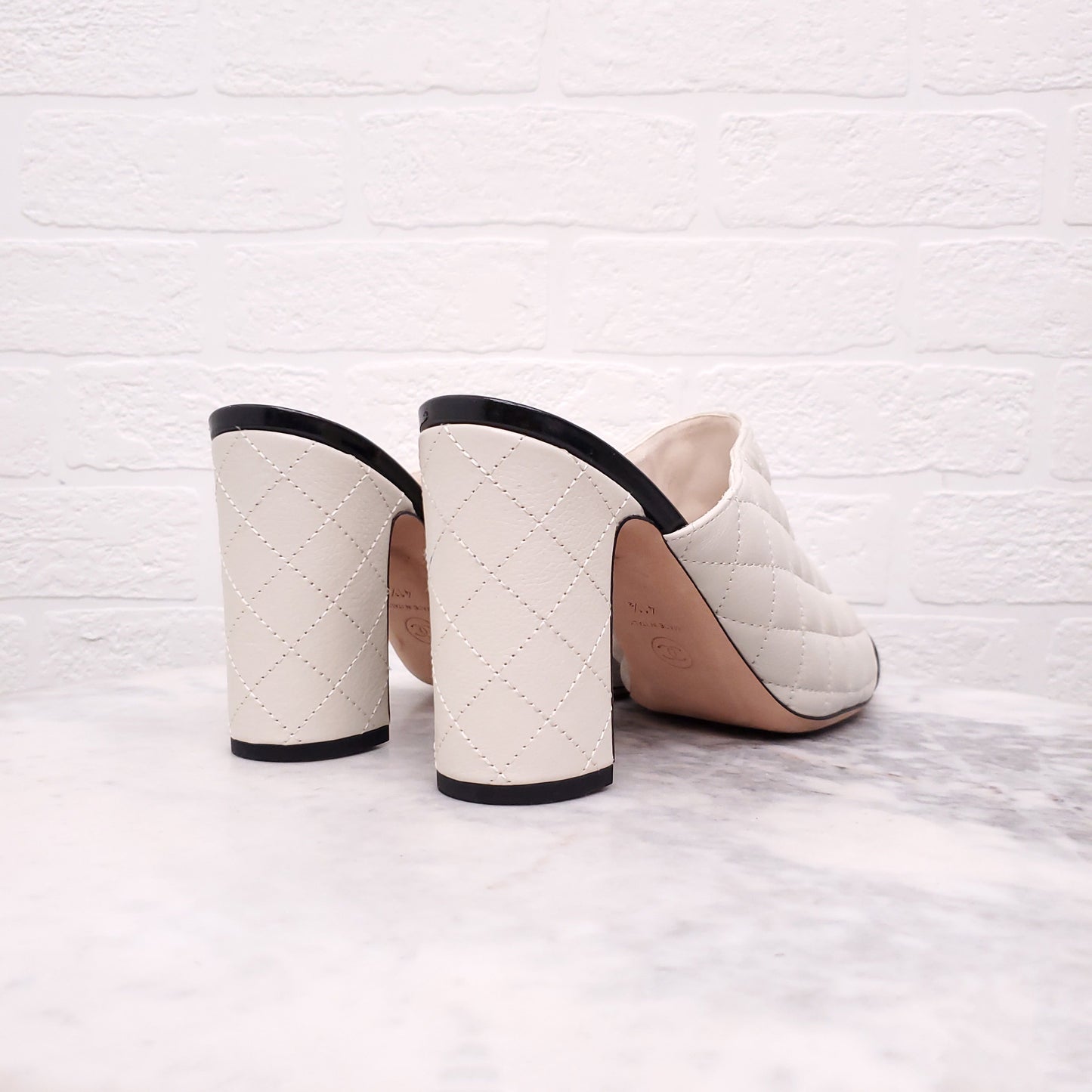 CHANEL CREAM AND BLACK TOE CAP QUILTED HEELED MULES - SIZE 41.5